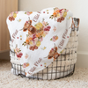 a blanket that is on top of a basket