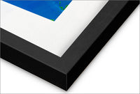 a black and white picture frame with a blue square