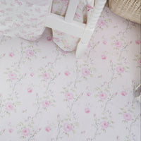 Floral patterned fabric with a basket on a matching background