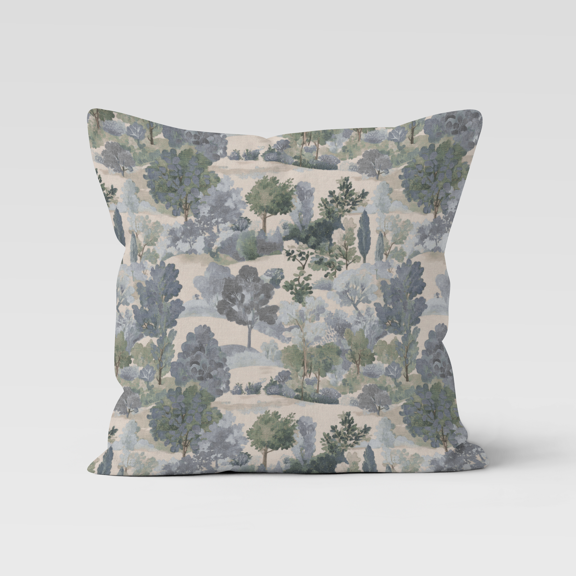Decorative pillow with nature-themed pattern on a light gray background