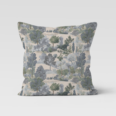 Decorative pillow with nature-themed pattern on a light gray background