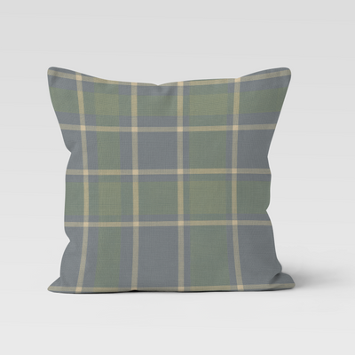 Plaid pillow with green and gray pattern on a white background