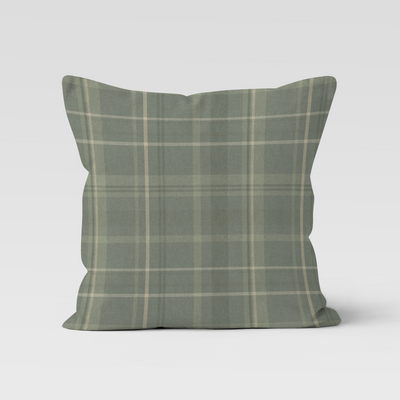Green plaid pillow on a white background