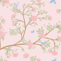 Pastel floral pattern with pink flowers, green leaves, and blue birds on a light pink background.