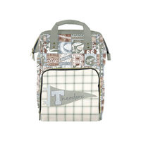 A personalized diaper bag featuring a collage of vintage baseball patches on the upper body and a cream and green plaid front pocket with a gray flag patch reading 'Theodore'.